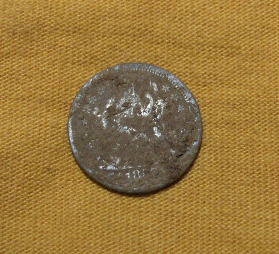 Seated Silver Before Cleaning - CW picket post find, 2007

Check out the story:

http://forum.treasurenet.com/index.php/topic,113377.0.html