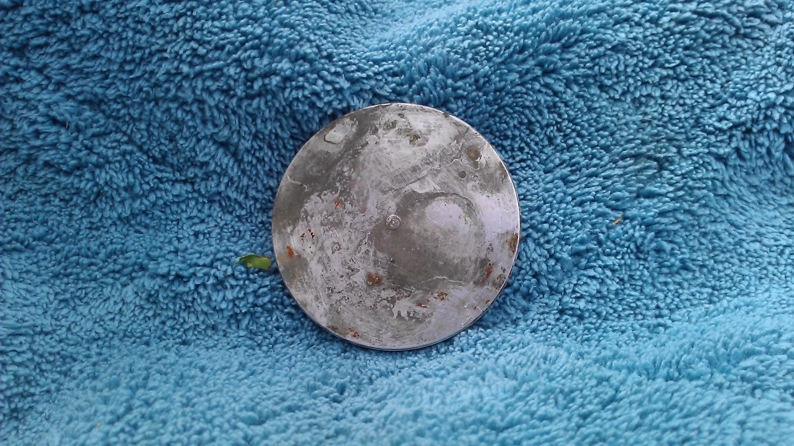 silver disk of some sort