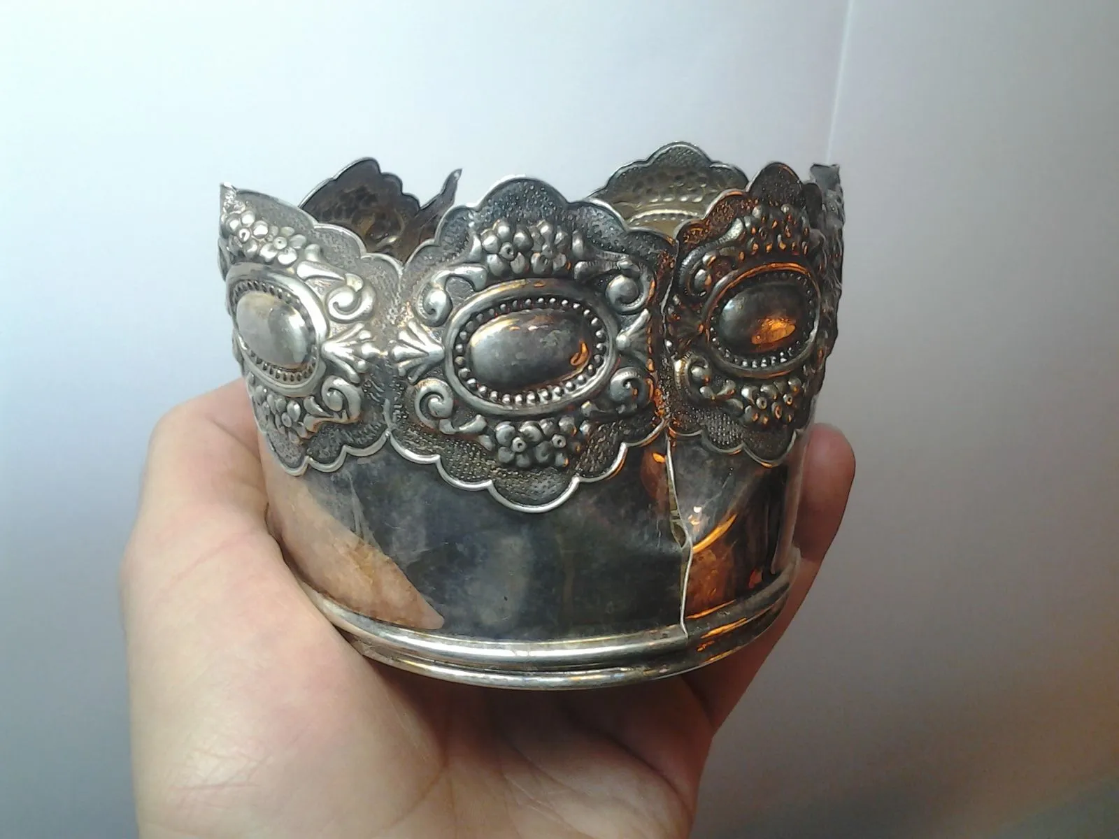 Sterling of January 8 2016. Just found out what it is, it's a sterling silver "wine bottle coaster". Someone had dough, too bad it's broken, still wor