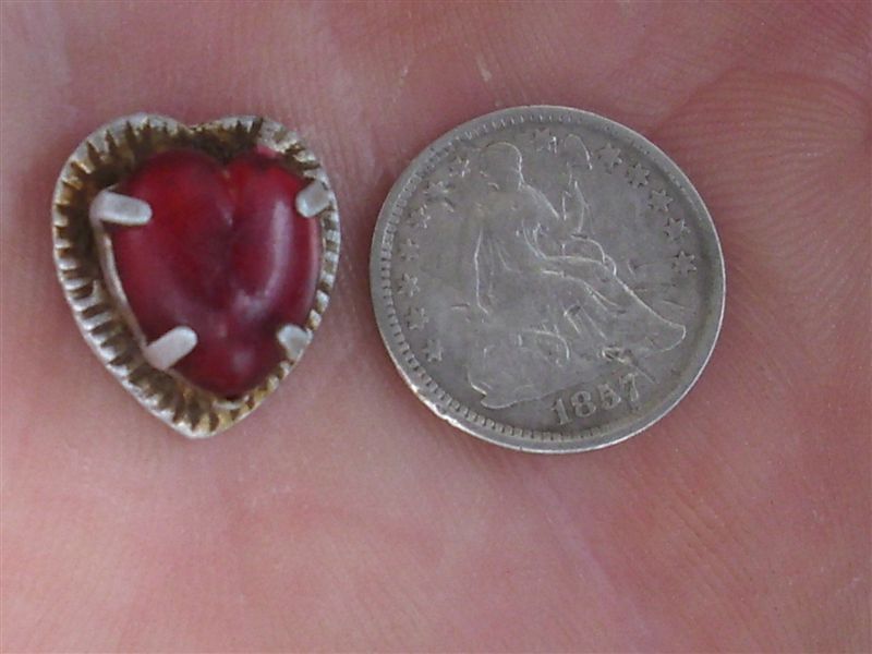 Strange heart pendant found in the same hole with the half dime.......