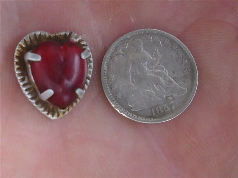 Strange heart pendant found in the same hole with the half dime.......