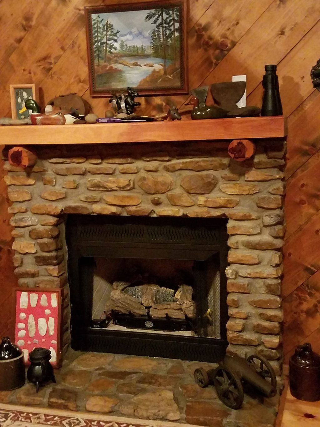 The fireplace.  Relics in frame on left found in Missouri when I lived there in the 1970's.  To the right is a civil war signal canon, heavy.
Very Ear
