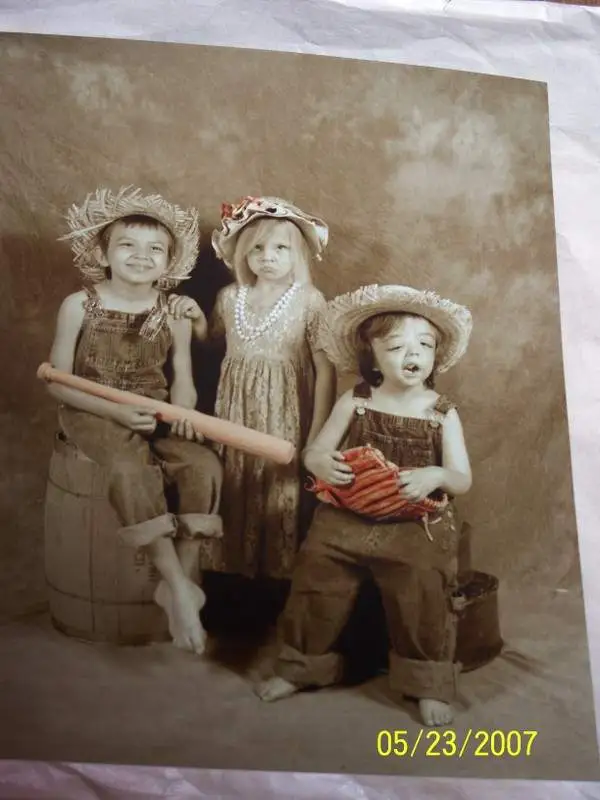 This is my very favorite pic ! Lok at Kirstins bottom lip she didn't get to hold any thing but, her brothers did!