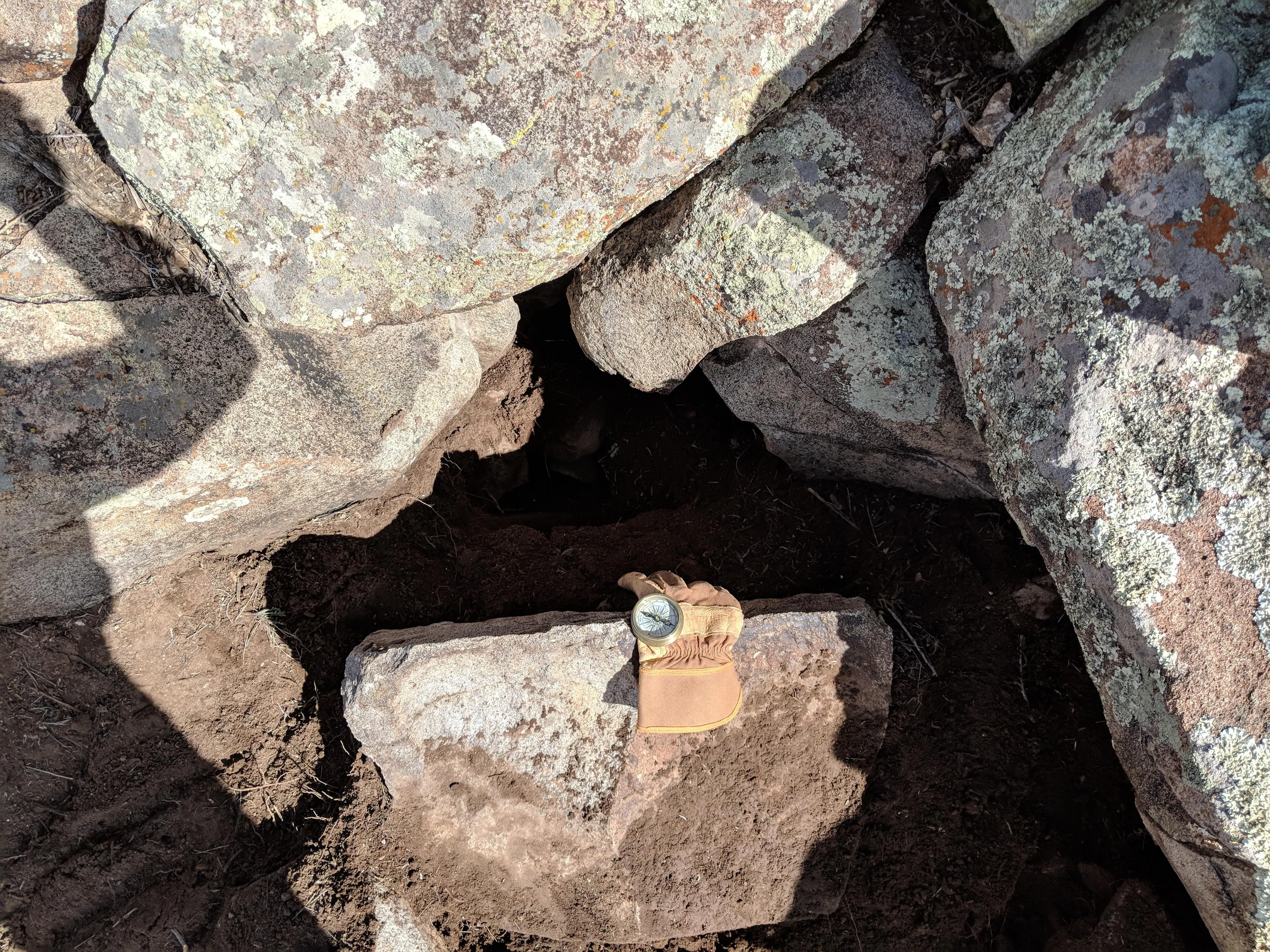 This spot is NW of the spaid with the W next to it note the the chiped Hart and the NW alinement of the slab + M shaped opening