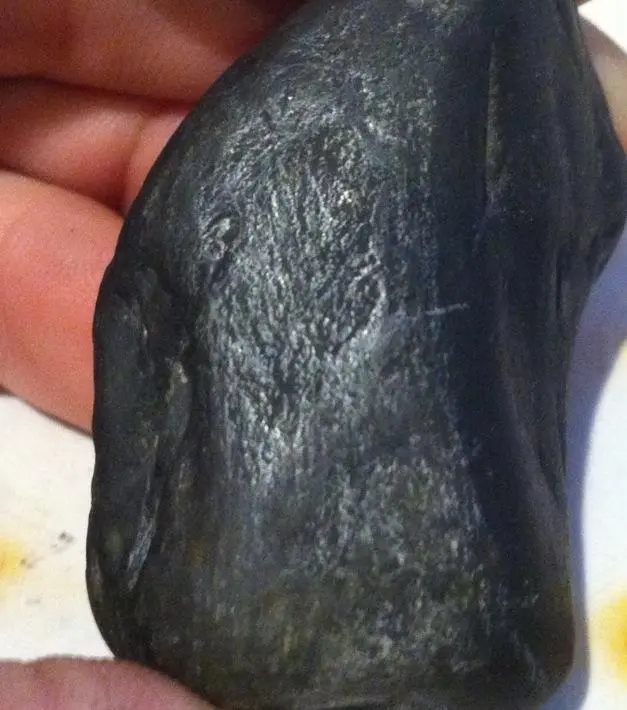up close photo of the lump and surface around it. Appears to have burned under high temperatures.