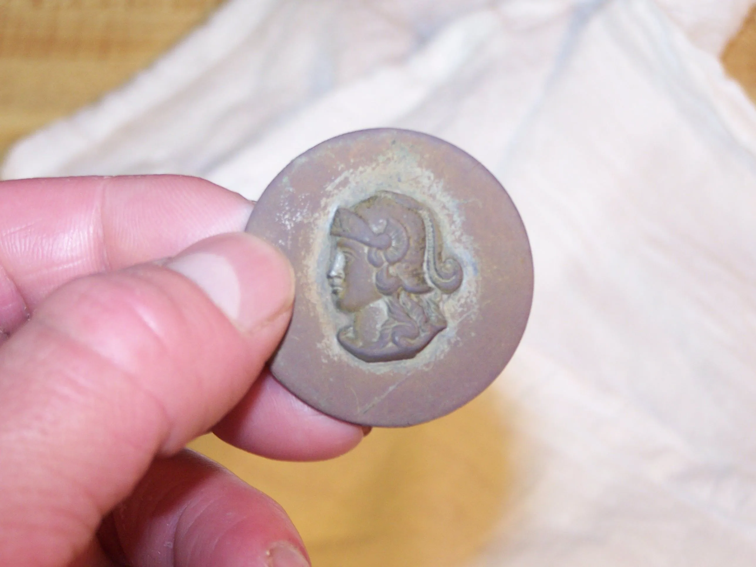 What am I? I found recently in old town town park and I can not find any info on it. I am not sure if its a button or shoe buckle or whatever. Any ide